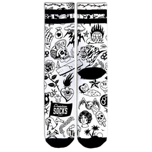 Worth It Mid High socks with a black and white flash tattoo pattern full of skulls, roses, panthers and pin up girls