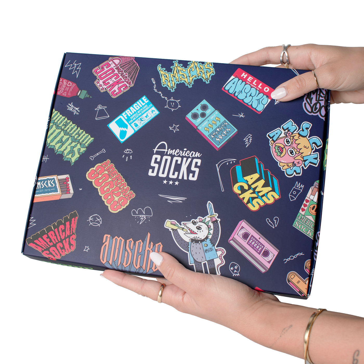 Hands holding up gift box with cool packaging with american socks logo in different styles 