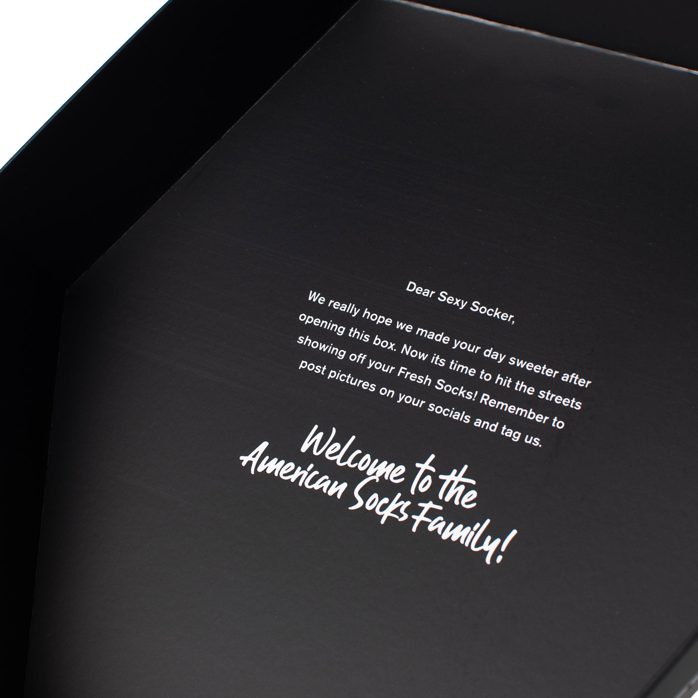 Close up of thank you message in the interior of skull gift box by american socks