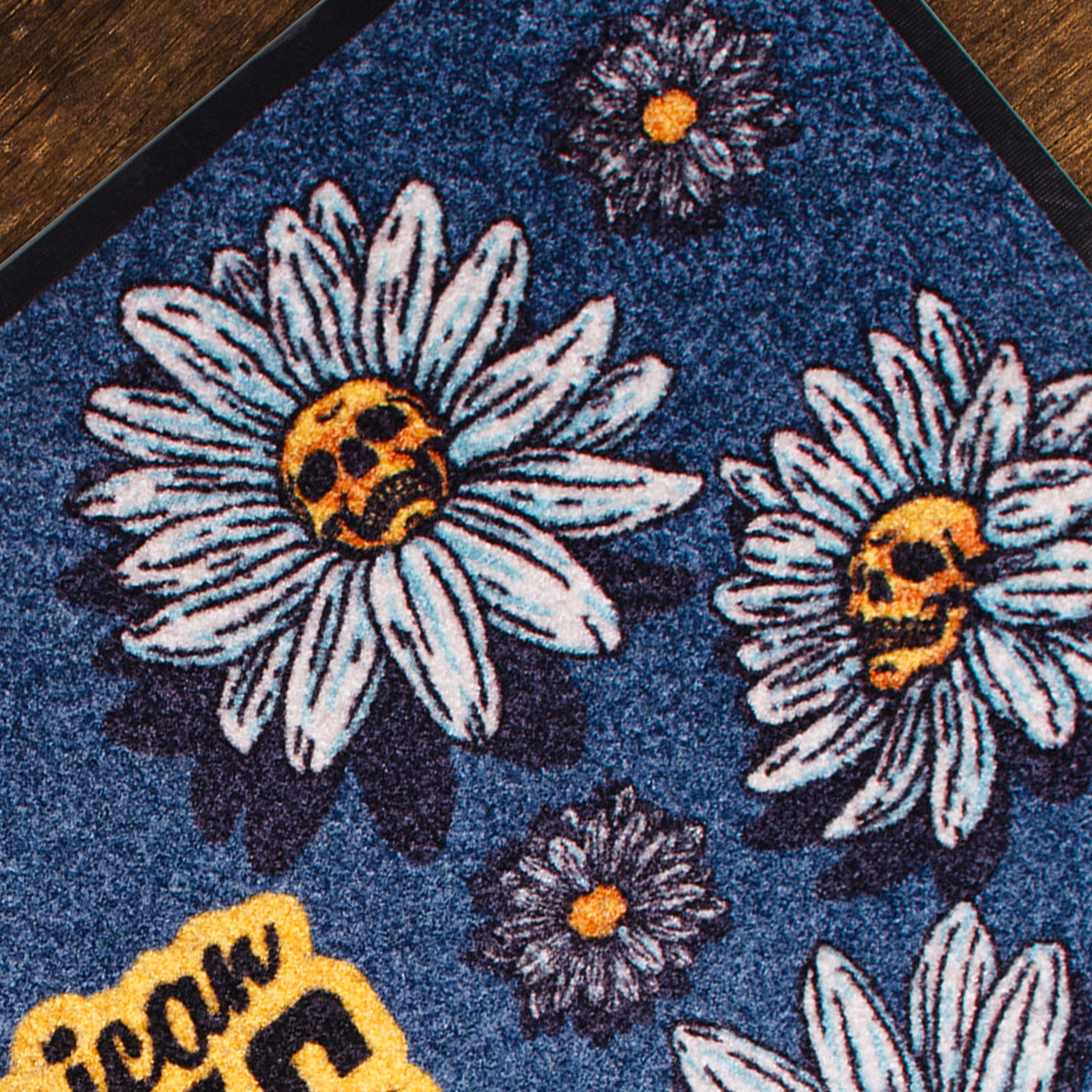 Close up of floral patterned rug with punk daisy flowers with skull in the middle design american socks 